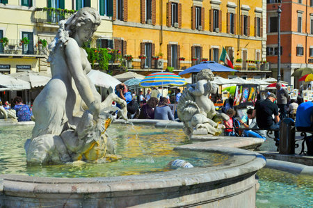 Rome, Italy - April 18, 2013: Detail of Fontana del Nettuno and ambiance in Piazza Navona in Rome, Italy. This popular city square is the largest in Romeのeditorial素材