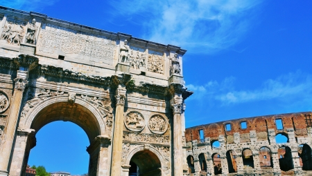 a view of the Arch of Constantine and the Coliseum in Rome, Italyの写真素材