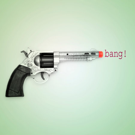 picture of a toy gun and the word bang on a blue background, with a retro effect