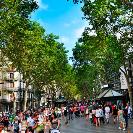 Barcelona, Spain - August 19, 2013 A crowd in La Rambla in Barcelona, Spain  Thousands of people walk daily by this popular pedestrian mall 1 2 kilometer-longのeditorial素材