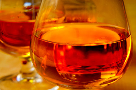 closeup of some cognac glasses with brandy