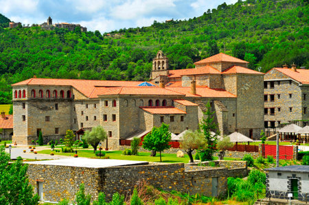 view of Virgen del Carmen Monastery in Boltanya, Huesca, Spain, and the small village in the backgroundのeditorial素材
