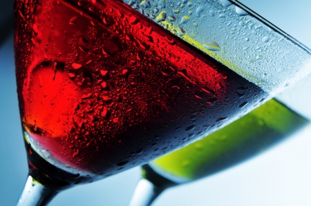 some cocktail glasses with beverages of different colors in a clubの写真素材