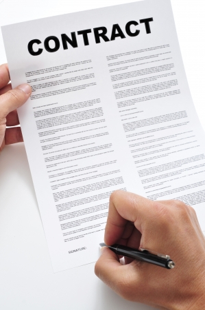 man signing a contractの写真素材