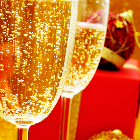 some glasses with champagne and some giftsの写真素材