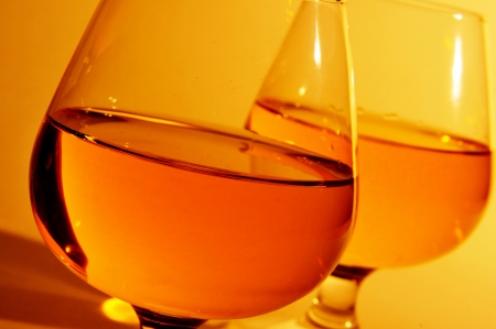 closeup of some cognac glasses with brandyの写真素材