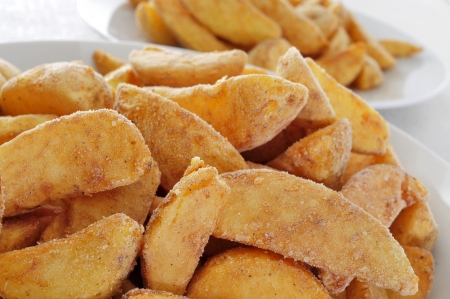 a bowl with frozen home fries ready to fryの写真素材