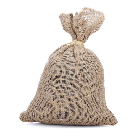 a full burlap sack tied with a string on a white backgroundの写真素材