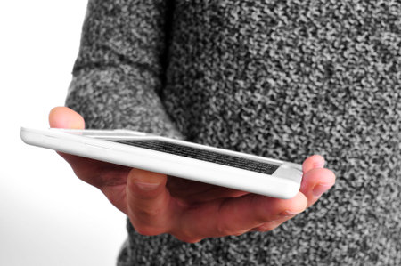 a man in casual wear using an e-book reader
