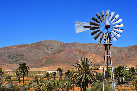 landscape of Antigua, in Fuerteventura, Canary Islands, Spain, with an old windpump in the foregroundの写真素材