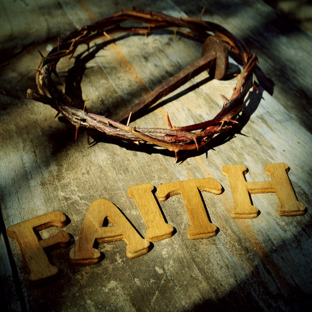 word faith and the Jesus Christ crown of thorns and a nail in the holy crossの写真素材