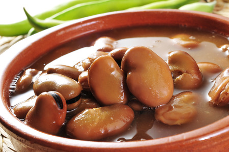 closeup of an earthenware bowl with broad bean stewの写真素材