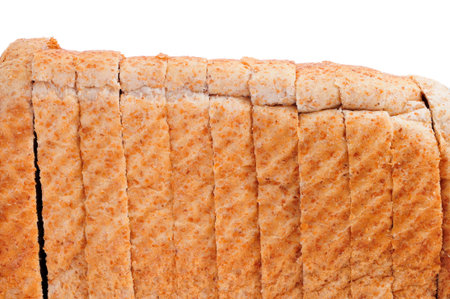 a loaf of sliced whole wheat bread isolated on white 