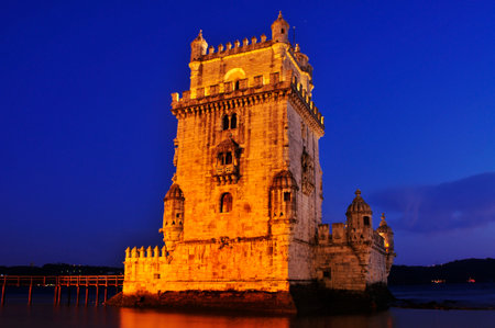 the Belem Tower at night in Lisbon, Portugalのeditorial素材