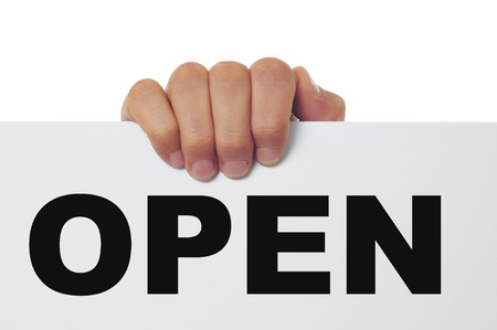 a man hand holding a signboard with the word open written in itの写真素材