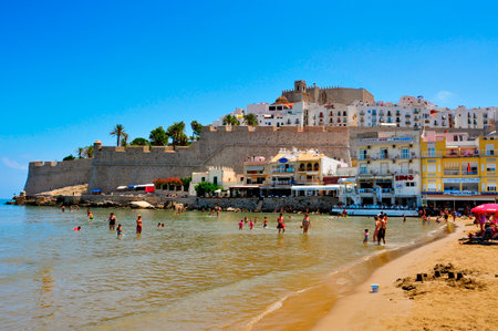 Peniscola, Spain - July 26, 2013  Bathers in North Beach, facing the castle in Peniscola, Spain  The town is a typical summer destination in the North of the Valencian Communityのeditorial素材