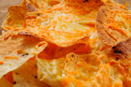 closeup of a bowl with nachos with cheeseの写真素材