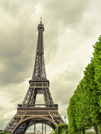 view of the Eiffel Tower in Paris, France, with an effect of old postcardの写真素材