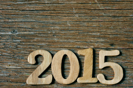 wooden numbers forming 2015, as the new year, on a rustic wooden sufaceの写真素材