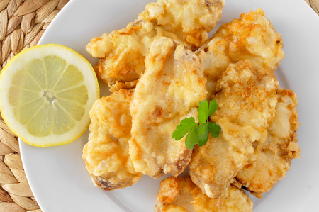 a plate with spanish rape rebozado, battered and fried anglerの写真素材