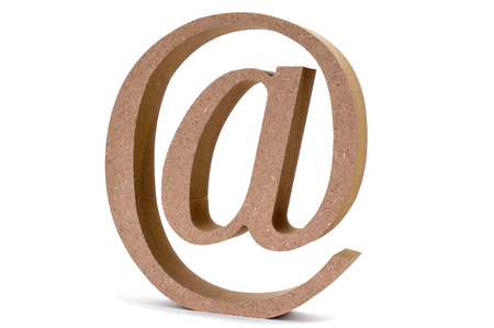 an engineered wood at-sign on a white backgroundの写真素材