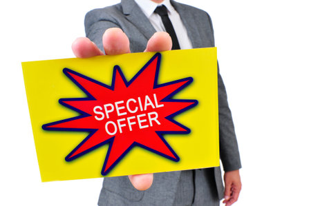 a man in suit showing a yellow signboard with the text special offer written in it