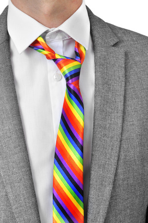 a businessman wearing a rainbow necktieの写真素材