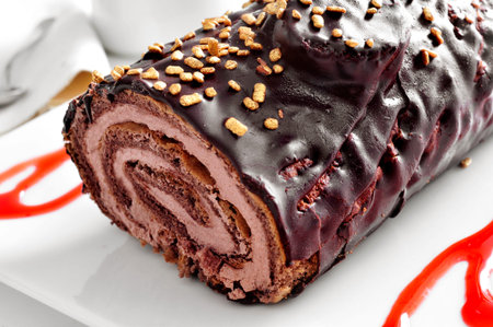 closeup of a yule log cake, traditional of christmas time, on a set tableの写真素材