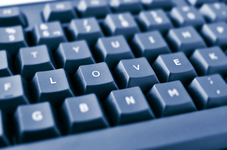 keys of a black keyboard forming the word loveの写真素材