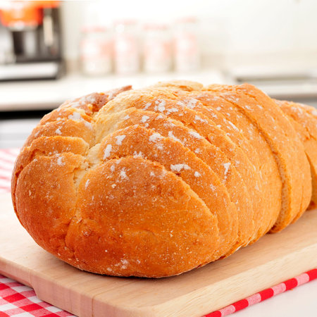 closeup of a sliced bread loaf on the kitchen table