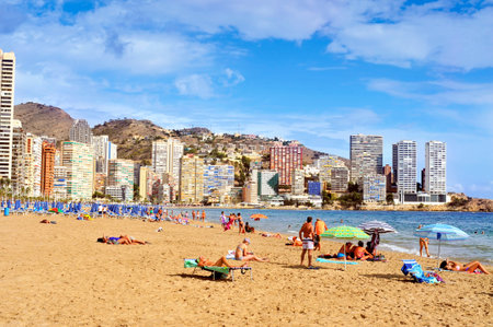 Benidorm, Spain - September 22, 2014: Vacationers in Levante Beach in Benidorm, Spain. Also known Beniyork because of the skyscrapers is a major beach destination for European tourismのeditorial素材