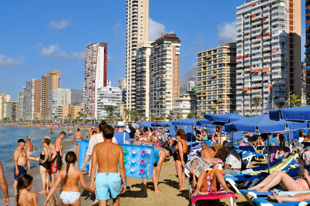 Benidorm, Spain - September 23, 2014: Vacationers in Levante Beach in Benidorm, Spain. Also known Beniyork because of the skyscrapers is a major beach destination for European tourismのeditorial素材