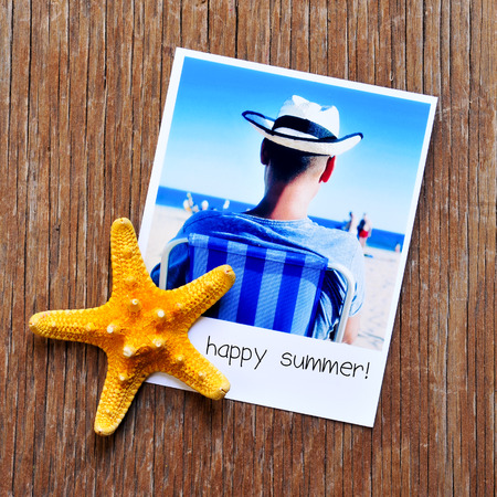 high-angle shot of a starfish and an instant photoの写真素材