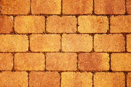 closeup of a orange stone wall or stone pavement background