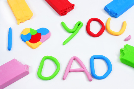 the text I love you dad made from modeling clay of different colorsの写真素材