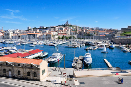 Marseille, France - May 17, 2015: The Old Port in Marseille, France, with the Notre-Dame de la Garde in the background. It is a busy port, used as a marina and terminal for boat tripsのeditorial素材