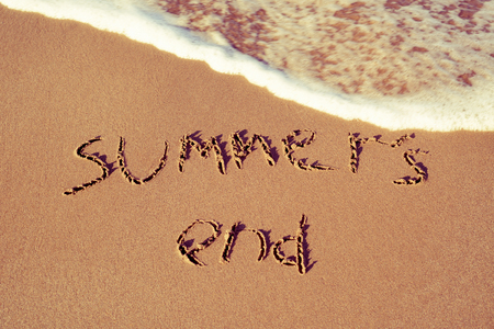 the text summers end written in the sand of a beachの写真素材