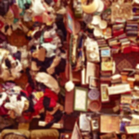 defocused blur background of an aerial view of a stall in a flea market full of bits and piecesの写真素材