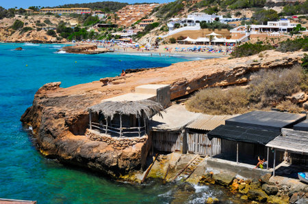 San Jose, Spain - June 15, 2015: A view of some fishermen shelters and the Cala Tarida beach in San Jose, in Ibiza Island, Spain. Ibiza is a well-known summer tourist destination in Europeのeditorial素材