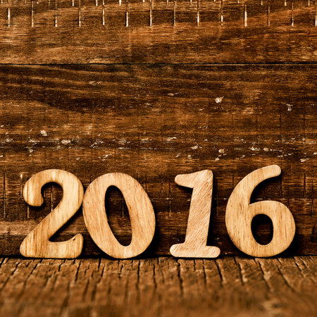 wooden numbers forming the number 2016, as the new year, on a rustic wooden surface
