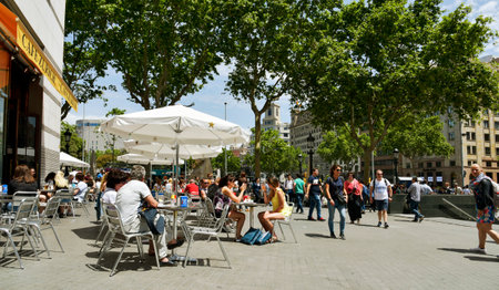 BARCELONA, SPAIN - MAY 22, 2017: Ambiance at the terrace of Cafe Zurich, next to Placa de Catalunya in Barcelona, Spain. This popular cafe, opened in 1862, was demolished and rebuilt in the same placeのeditorial素材