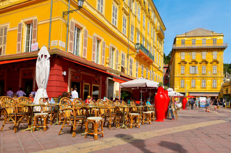 NICE, FRANCE - JUNE 4, 2017: A view of the ambiance and a typical French cafe in the Charles Felix Square in the center of the Vielle Ville, the Old Town, of this popular city in the French Rivieraのeditorial素材