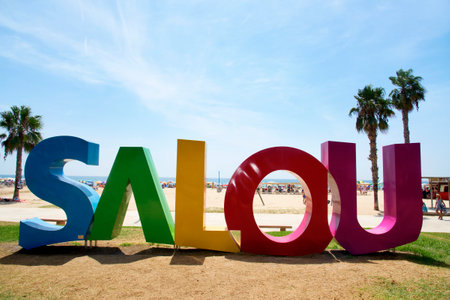 SALOU, SPAIN - AUGUST 3, 2017: A big Salou sign at the Llevant Beach in Salou, Spain. Salou is a major destination for sun and beach for European tourism with more than 50,000 accommodationsのeditorial素材