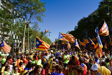 BARCELONA, SPAIN - SEPTEMBER 11, 2017: People in the Passeig de Gracia, in Barcelona, Spain,...