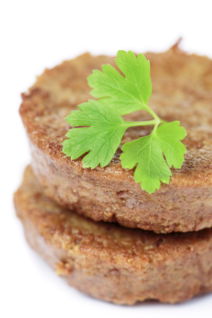 closeup of some tofu burgers on a white backgroundの写真素材