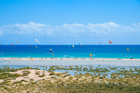 FUERTEVENTURA, SPAIN - NOVEMBER 5, 2017: Some kitesurfers in the Sotavento Beach in Fuerteventura, Canary Islands, Spain, a popular destination to practice this sportのeditorial素材