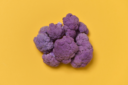 high angle view of a purple cauliflower on an orange backgroundの写真素材