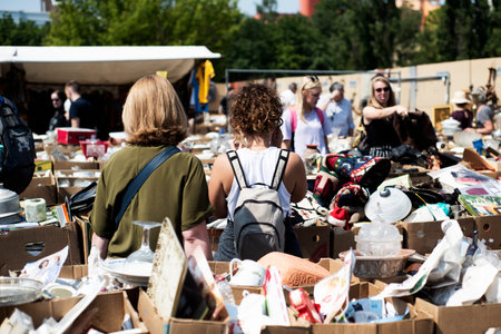 BERLIN, GERMANY - MAY 27, 2018: People shopping at the popular Flohmarkt am Mauerpark flea market in...