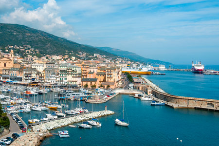 BASTIA, FRANCE - SEPTEMBER 16, 2018: A view of the Vieux Port, the Old Port of Bastia, in Corsica, France, on the left and the new commercial port on the rightのeditorial素材