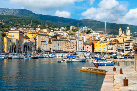 BASTIA, FRANCE - SEPTEMBER 16, 2018: A view of the Vieux Port, the Old Port of Bastia, in Corsica, France, higlighting the twin bell towers of the Saint-Jean-Baptiste church on the rightのeditorial素材